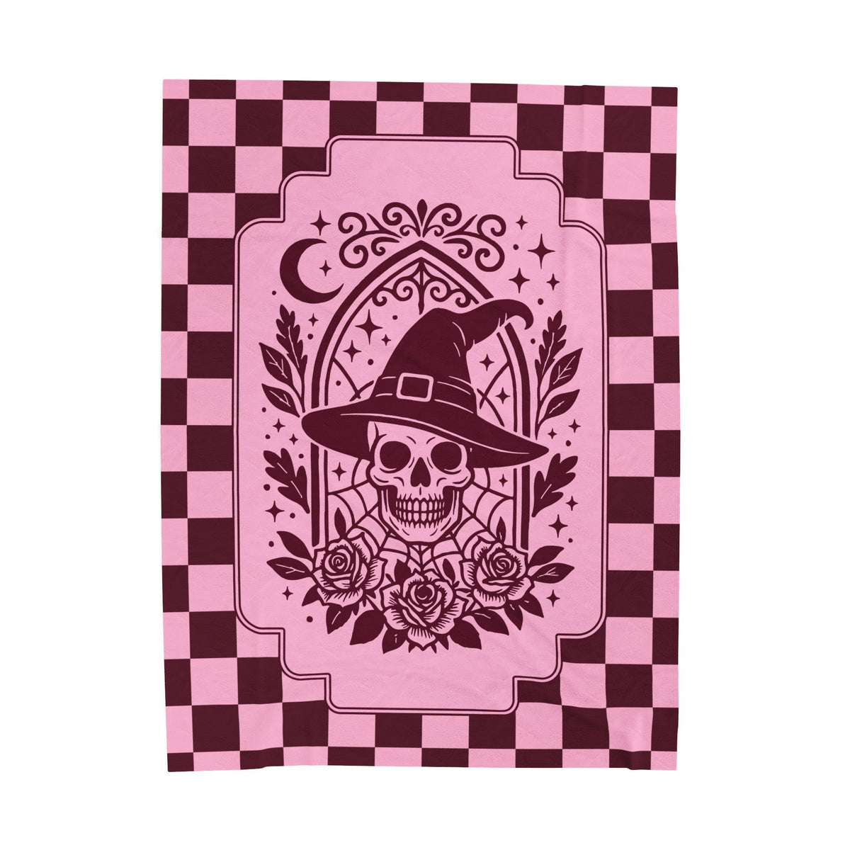 A velveteen throw blanket featuring a dark burgundy and pink checkerboard border and a central graphic of a skull wearing a witch hat with roses, stars, and a crescent moon.