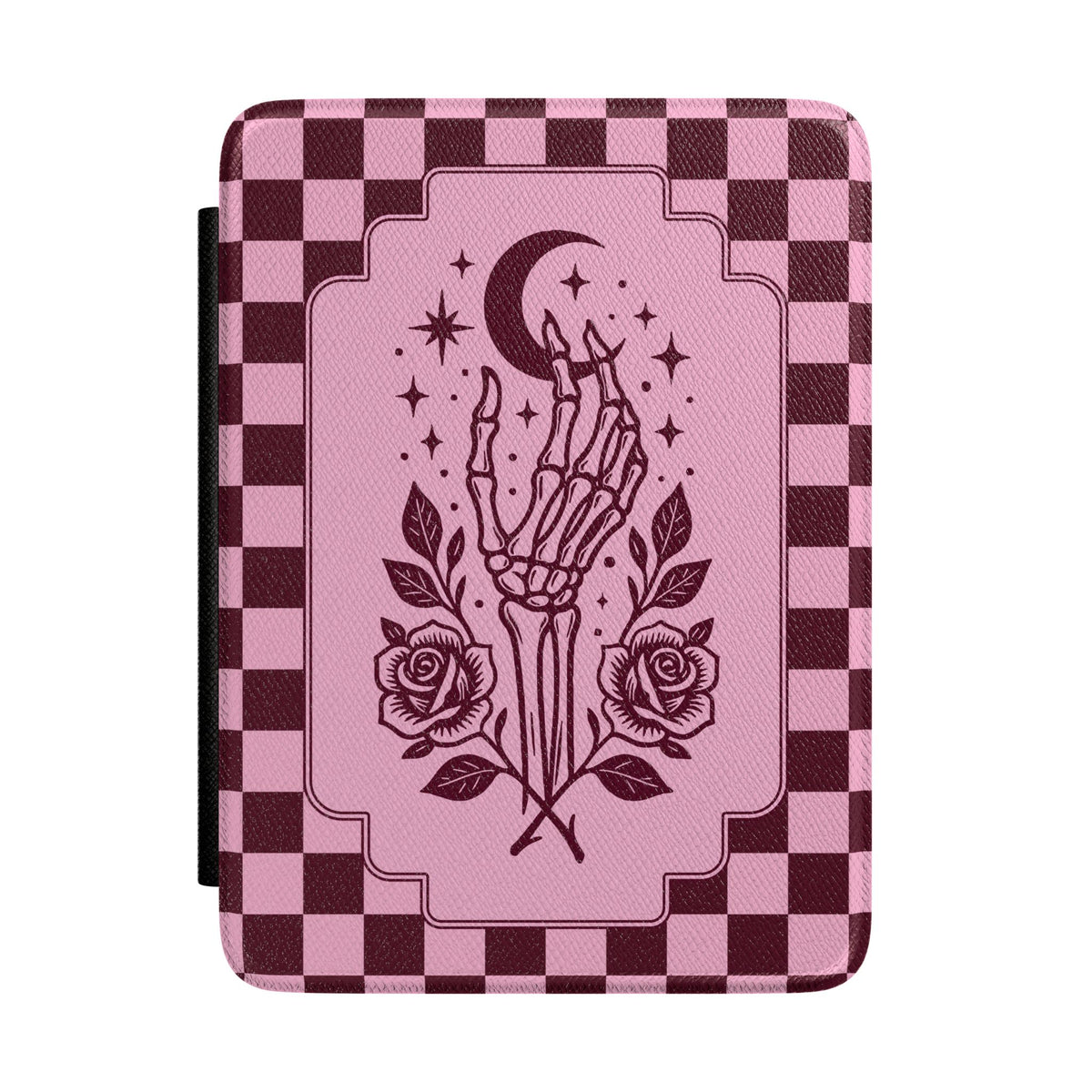 A tablet case featuring a pink and dark burgundy checkerboard pattern, with a central graphic of a skeletal hand reaching up toward a crescent moon and stars, flanked by two roses.