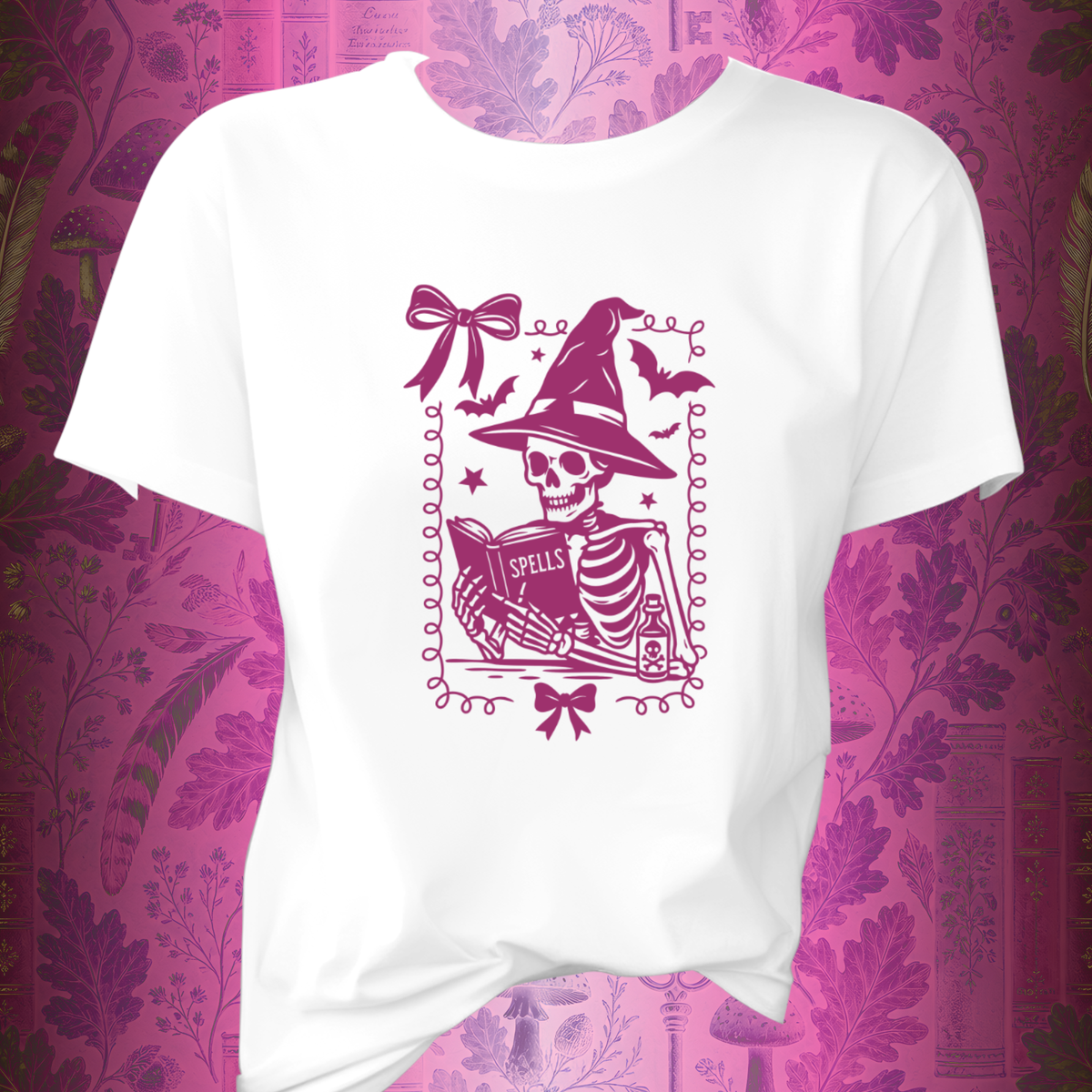 Pink Reading Witch Skeleton Tee — Cute Halloween Aesthetic Graphic T-Shirt