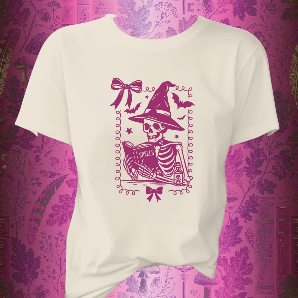 Pink Reading Witch Skeleton Tee — Cute Halloween Aesthetic Graphic T-Shirt