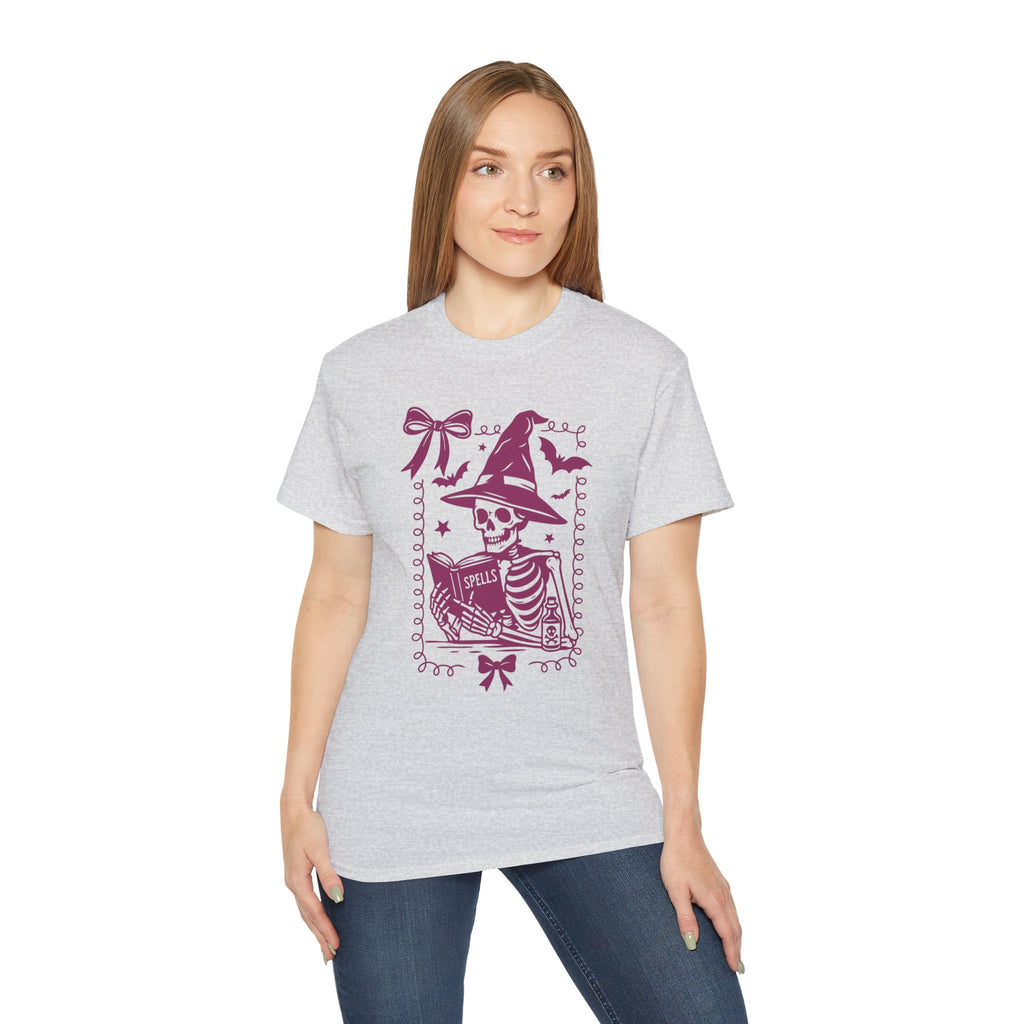Pink Reading Witch Skeleton Tee — Cute Halloween Aesthetic Graphic T-Shirt