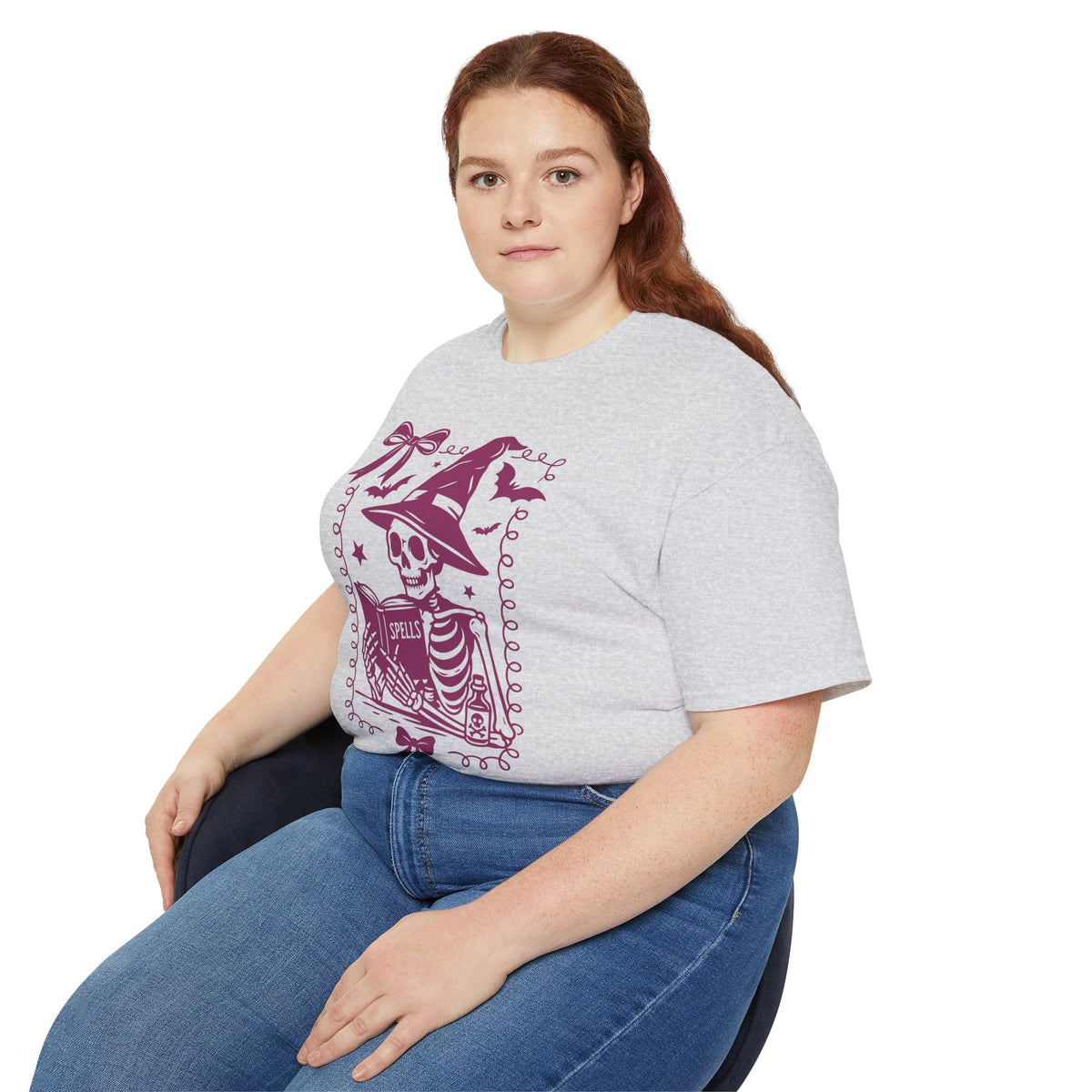 Pink Reading Witch Skeleton Tee — Cute Halloween Aesthetic Graphic T-Shirt